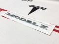 эмблема Tesla Model X 1 поколение (2015 - 2021), электро, 1474572-00-A, 1047855-00-A - фото №3
