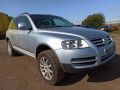 суппорт передний левый Volkswagen Touareg 1 поколение 2004, 2.5 л., АКПП, внедорожник 5 дв., 7H0615123C - фото №11