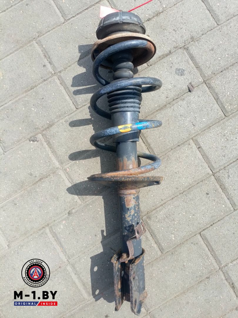 стойка передняя левая Renault Logan 1 поколение (2004 - 2009), 1.5 л., дизель - фото №1