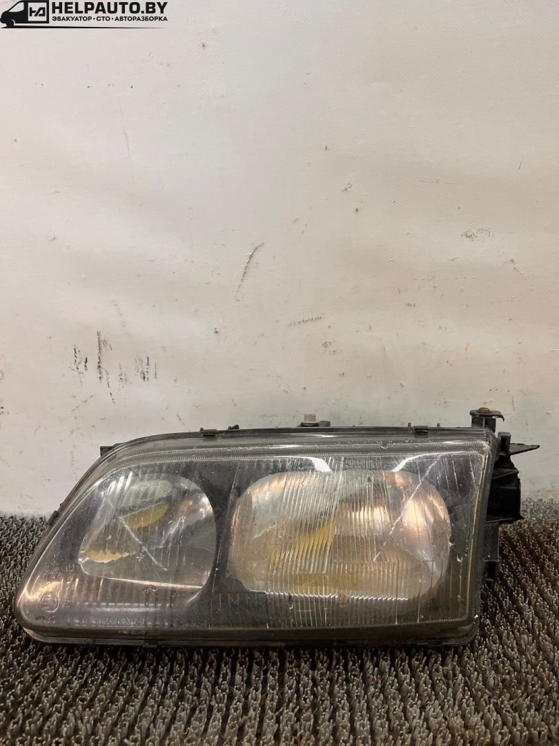 фара левая Mazda 626 GF 1997, 2.0 л., дизель, МКПП, зелёный, седан, передний привод - фото №1