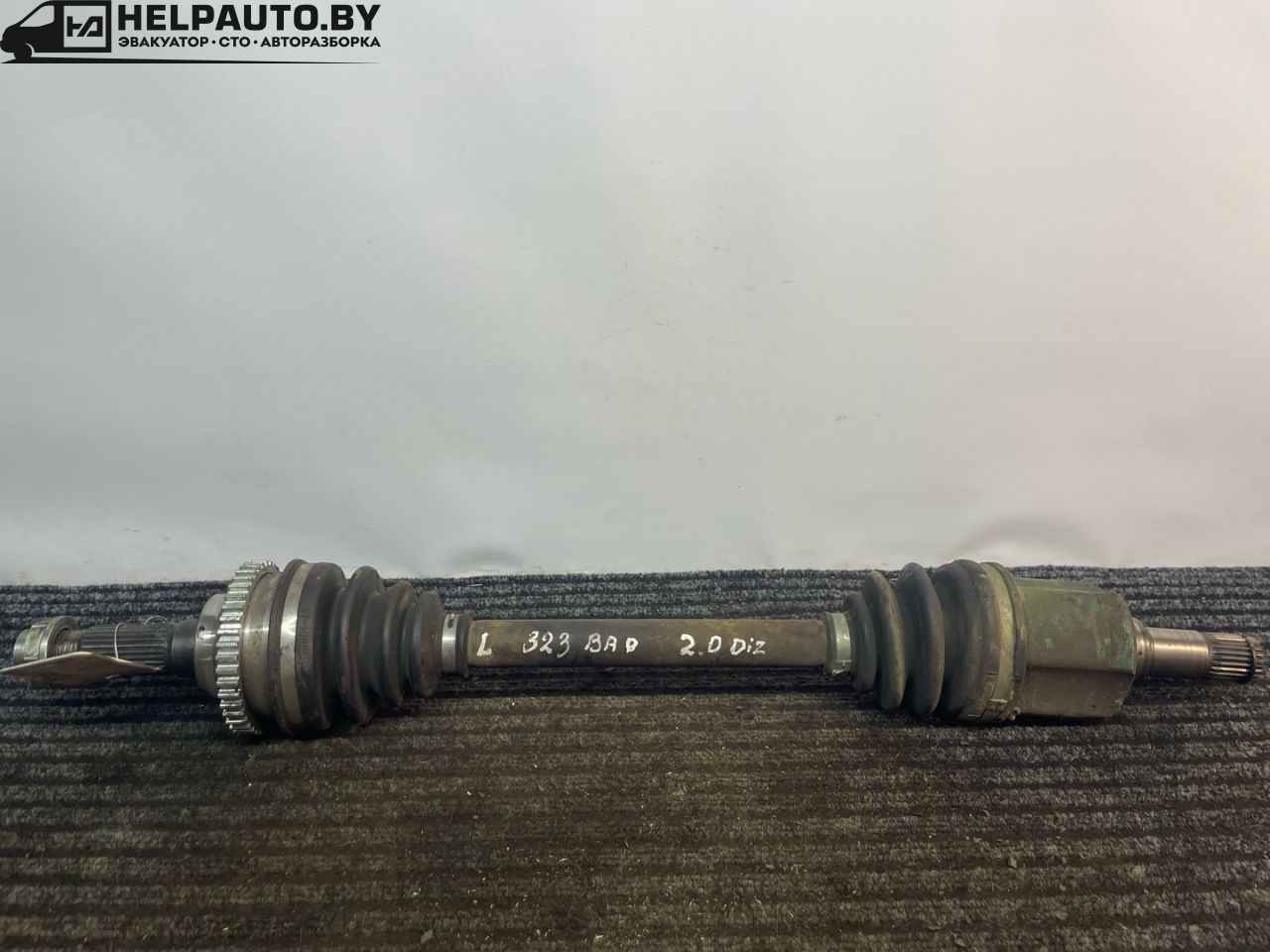 полуось передняя левая (приводной вал, ШРУС) Mazda 323 6 поколение 1998, 2.0 л., дизель, МКПП, синий, хетчбэк 3 дв. - фото №1