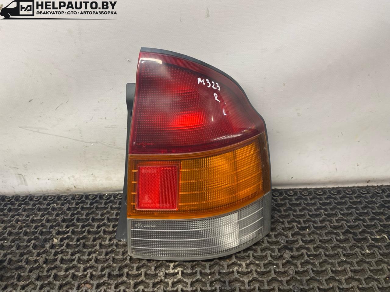 фонарь задний правый Mazda 323 6 поколение 1998, 1.4 л., бензин, МКПП, синий, хетчбэк 3 дв., передний привод, 0023245 - фото №1