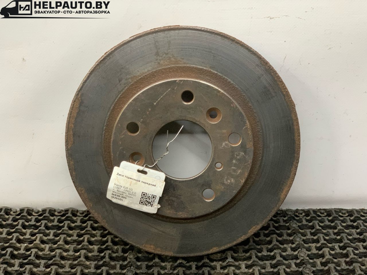 диск тормозной передний Mazda 626 3 поколение GD (1987 - 1992), 2.0 л., бензин, МКПП, желтый, седан, передний привод - фото №1