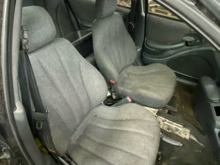салон (комплект сидений) Pontiac Sunfire 1 поколение 1999, 2.2 л., бензин, АКПП, черный, передний привод