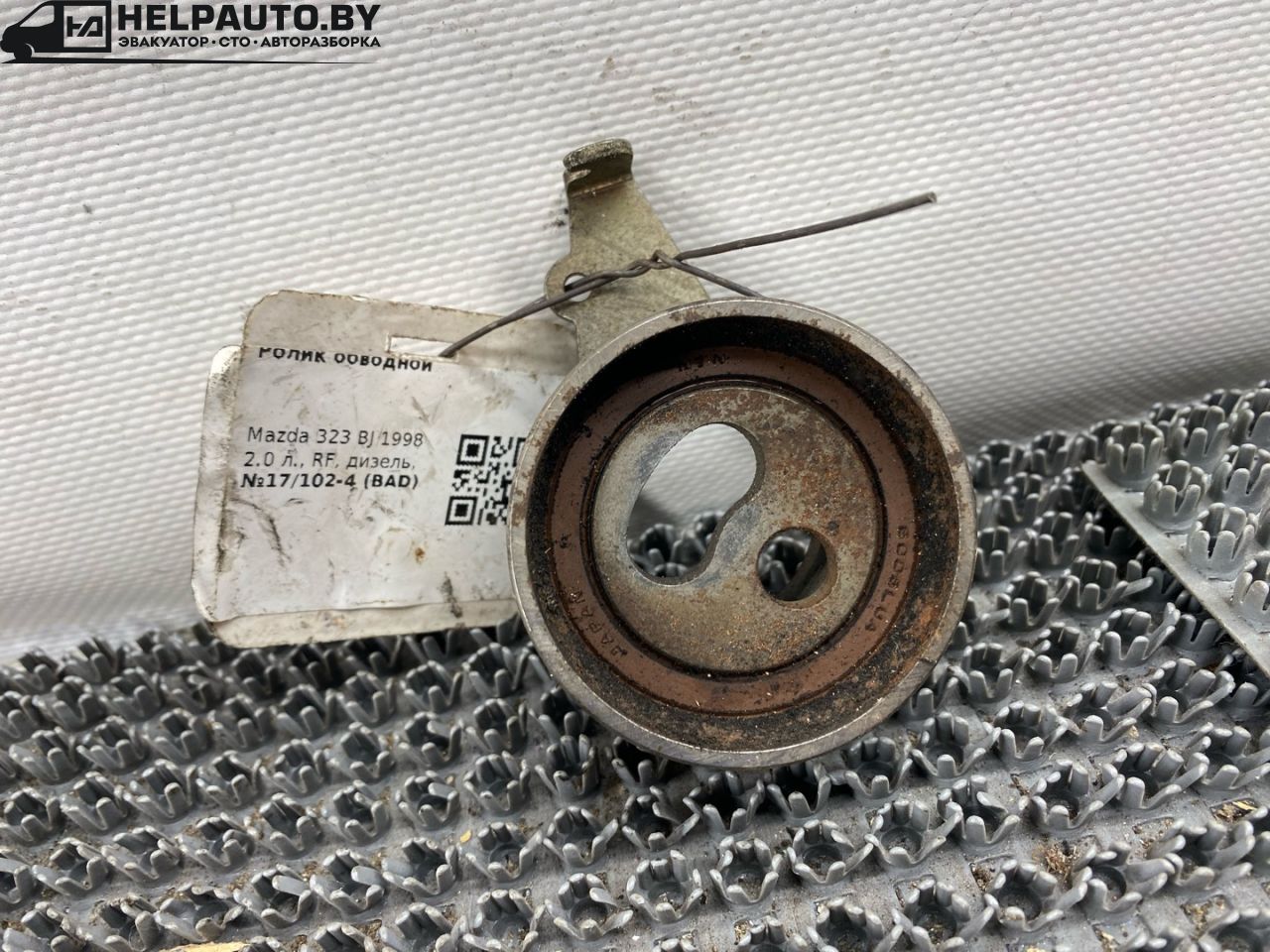 Ролик обводной Mazda 323 6 поколение 1998, 2.0 л., дизель, МКПП, синий, хетчбэк 3 дв. - фото №1