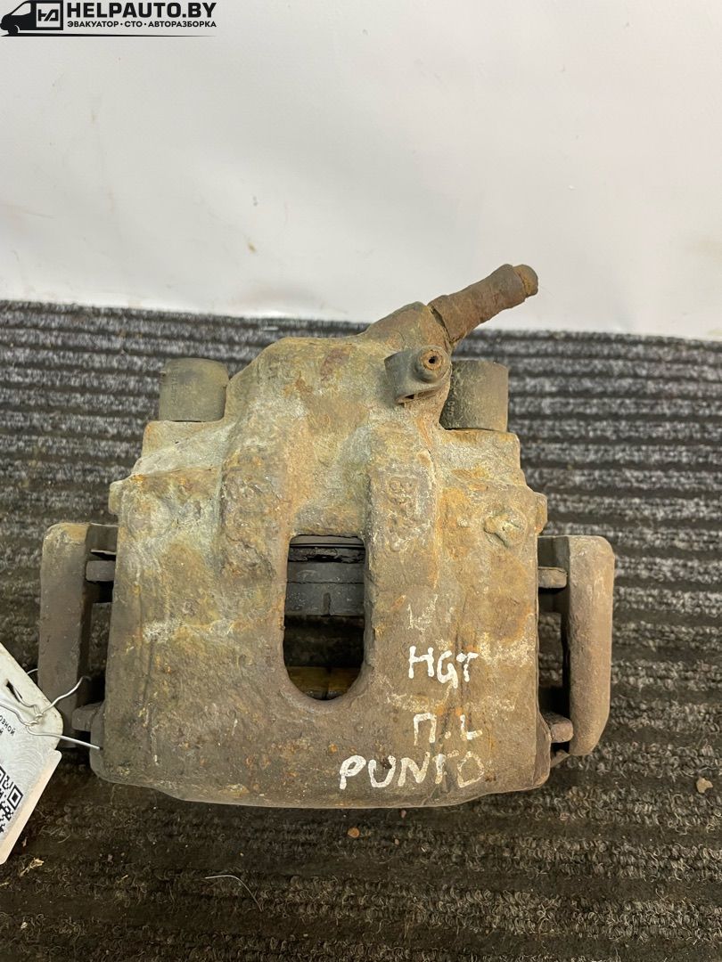 суппорт передний левый Fiat Punto 2 поколение 2002, 1.8 л., 188 A6.000, бензин, МКПП, серый, хетчбэк 3 дв., передний привод - фото №1