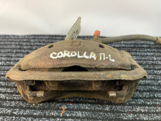 суппорт передний левый Toyota Corolla 5 поколение (E80) 1984, 1.3 л., бензин, МКПП, красный, хетчбэк 5 дв., передний привод