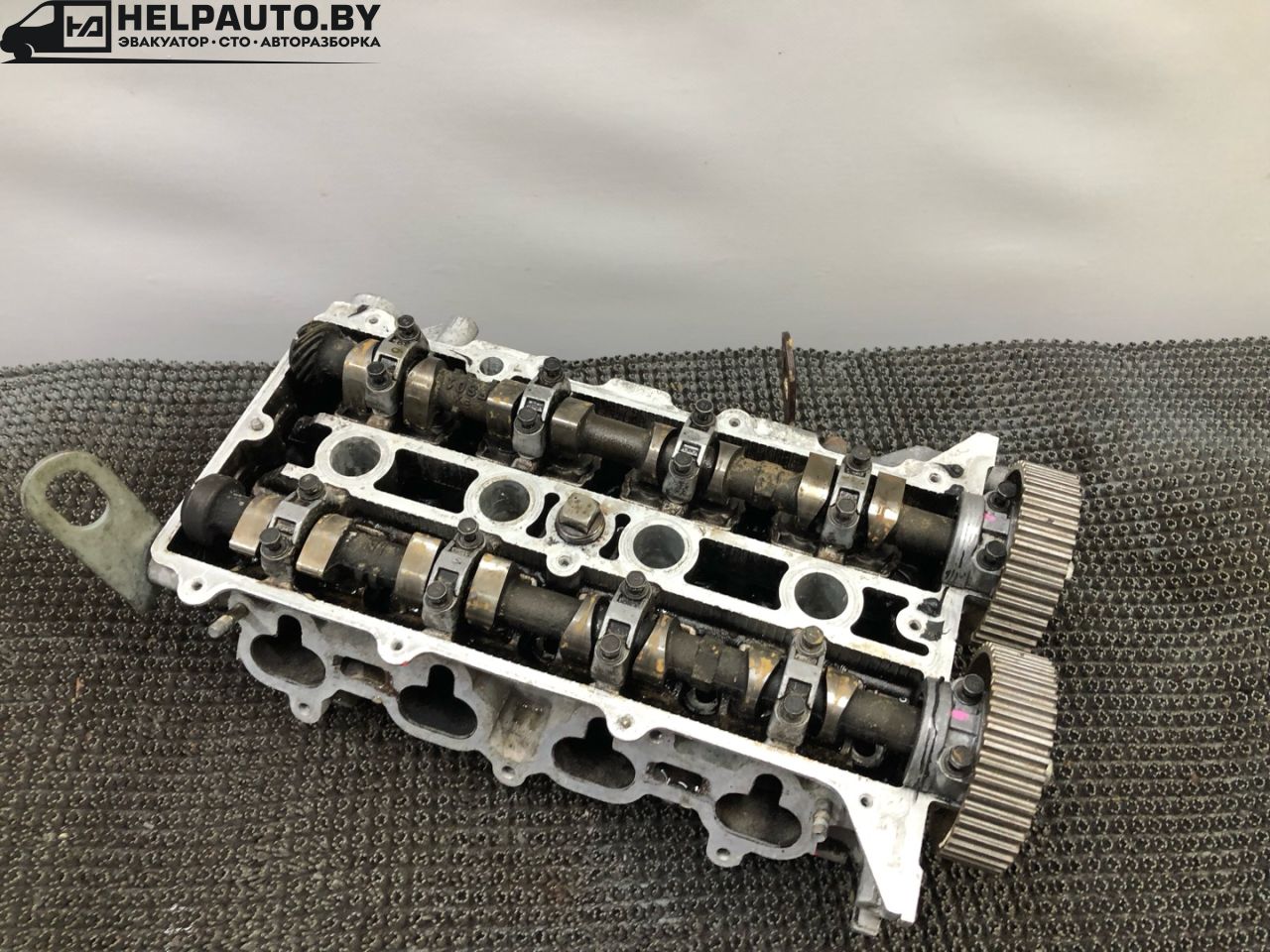 головка блока цилиндров Mazda 626 GE 1994, 1.8 л., FP, бензин, МКПП, бордовый, седан, передний привод - фото №1