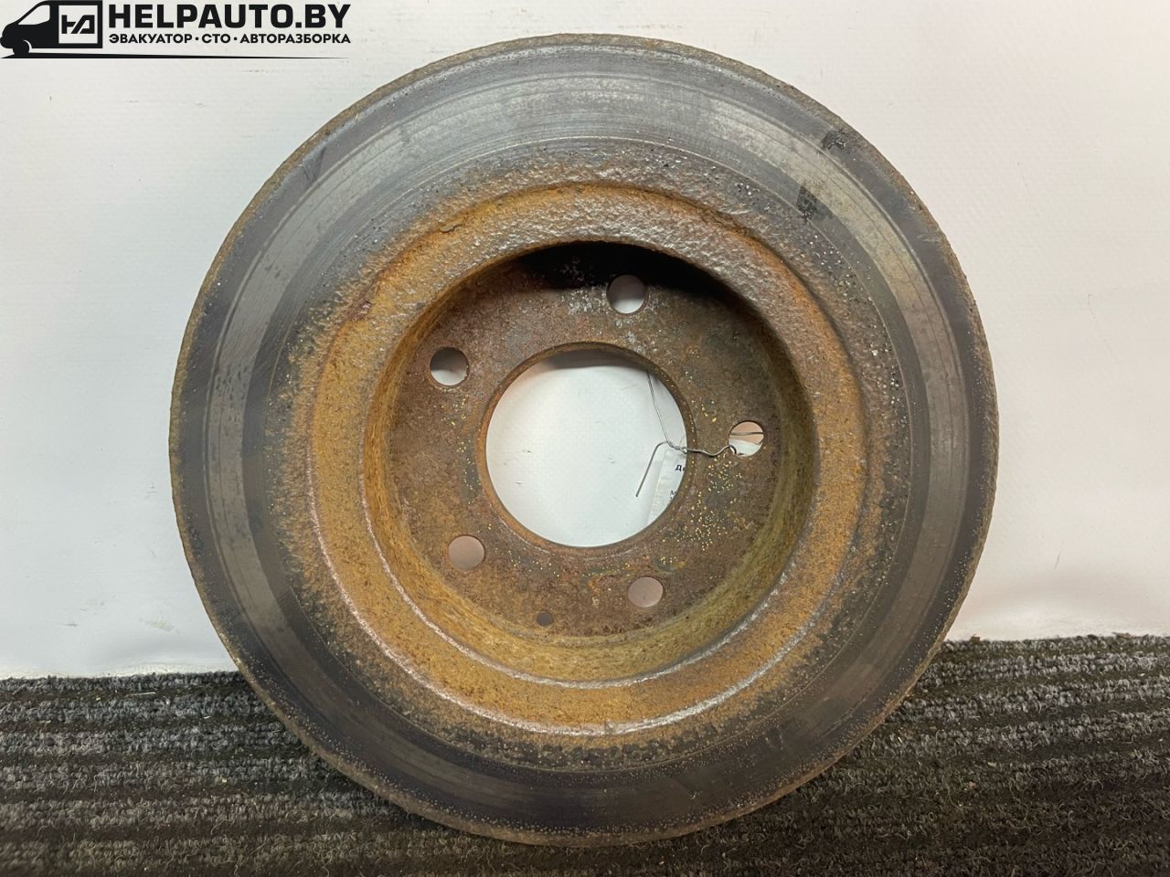 диск тормозной задний Mazda 626 GE 1994, 1.8 л., FP, бензин, МКПП, бордовый, седан, передний привод - фото №1
