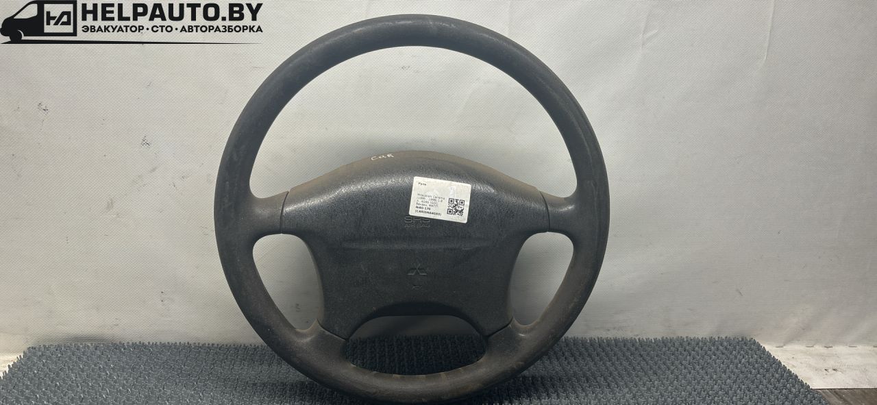 руль Mitsubishi Carisma 1 поколение (1995 - 1999), 1.8 л., 4G93 (GDI), бензин, МКПП, серебро, хетчбэк 5 дв., передний привод - фото №1
