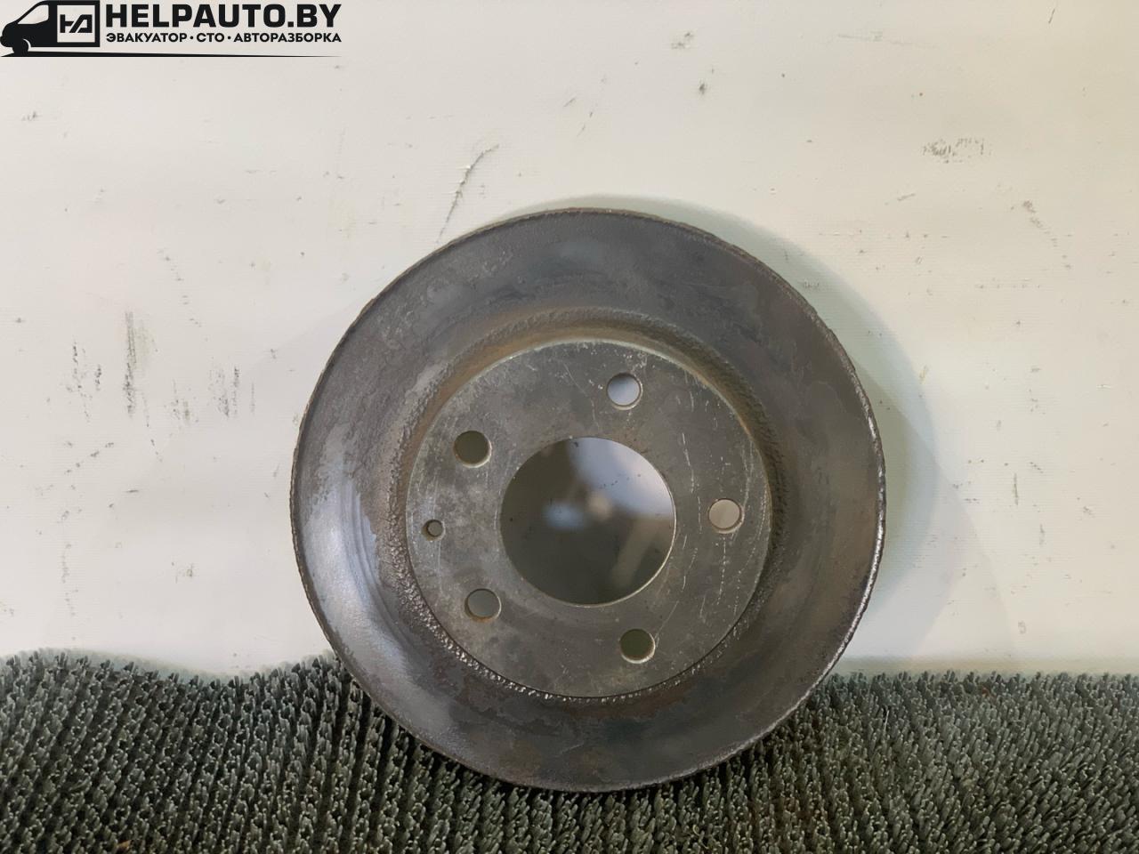 диск тормозной передний Mazda 626 GF 1997, 2.0 л., дизель, МКПП, зелёный, седан, передний привод - фото №1