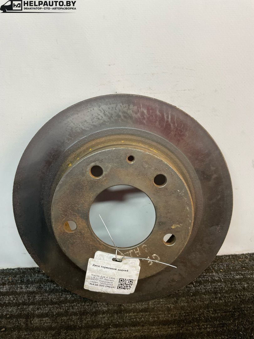 диск тормозной задний Mazda 626 GE 1994, 1.8 л., FP, бензин, МКПП, бордовый, седан, передний привод - фото №1