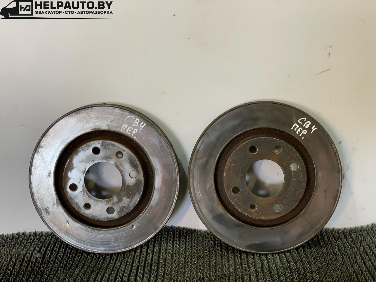 диск тормозной передний Citroen Berlingo 1 поколение (M49) 1998, 1.9 л., DHX (XUD9TF/BTF), дизель, МКПП, белый, фургон, передний привод - фото №1