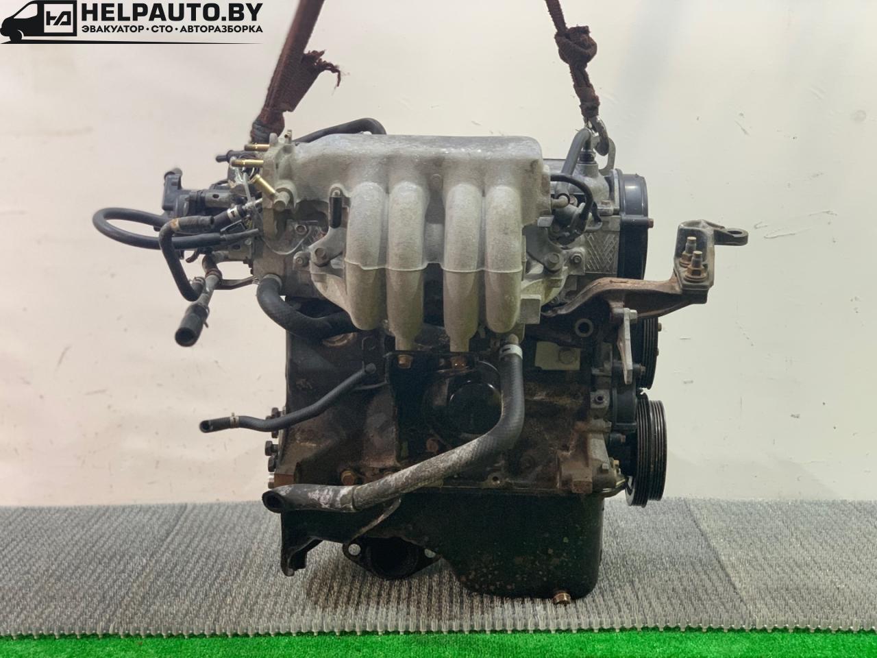 коллектор впускной Mazda 323 6 поколение 1998, 1.4 л., бензин, МКПП, синий, хетчбэк 3 дв., передний привод - фото №1