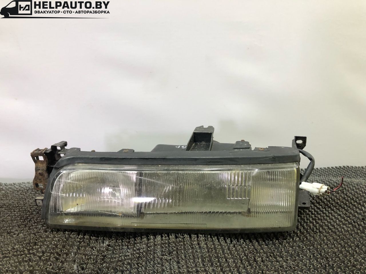 фара левая Mazda 626 3 поколение GD (1987 - 1992), 2.0 л., бензин, МКПП, желтый, седан, передний привод - фото №1
