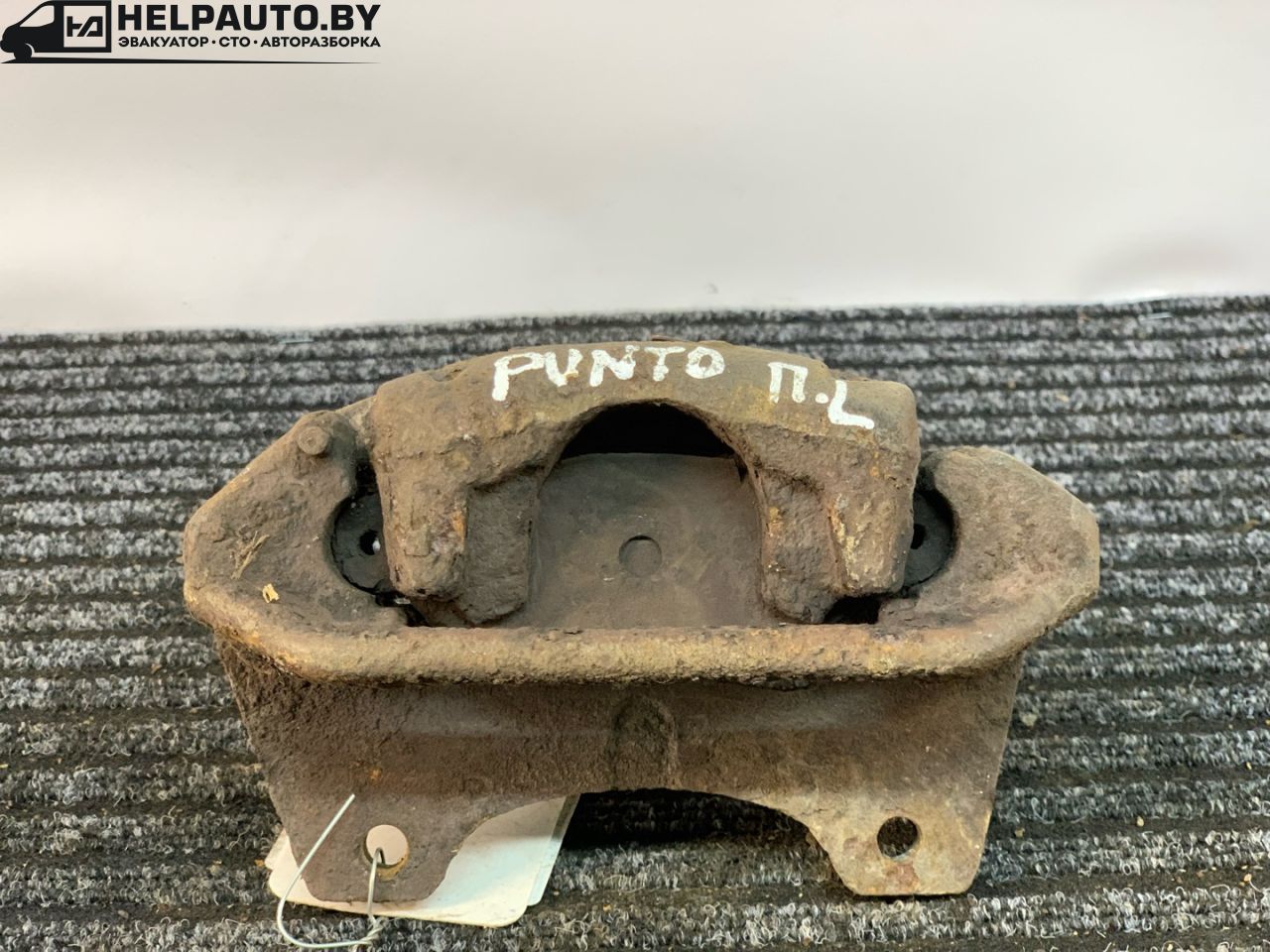 суппорт передний левый Fiat Punto 2 поколение 2002, 1.2 л., 188 A4.000, бензин, 5МКПП, серый, хетчбэк 3 дв., передний привод - фото №1