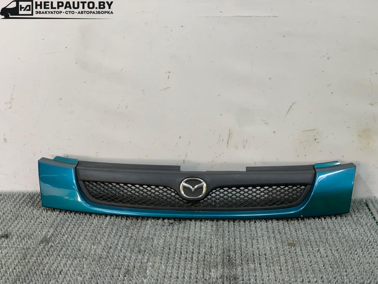 решетка радиатора Mazda 323 6 поколение 1998, 1.4 л., бензин, МКПП, синий, хетчбэк 3 дв., передний привод - фото №1