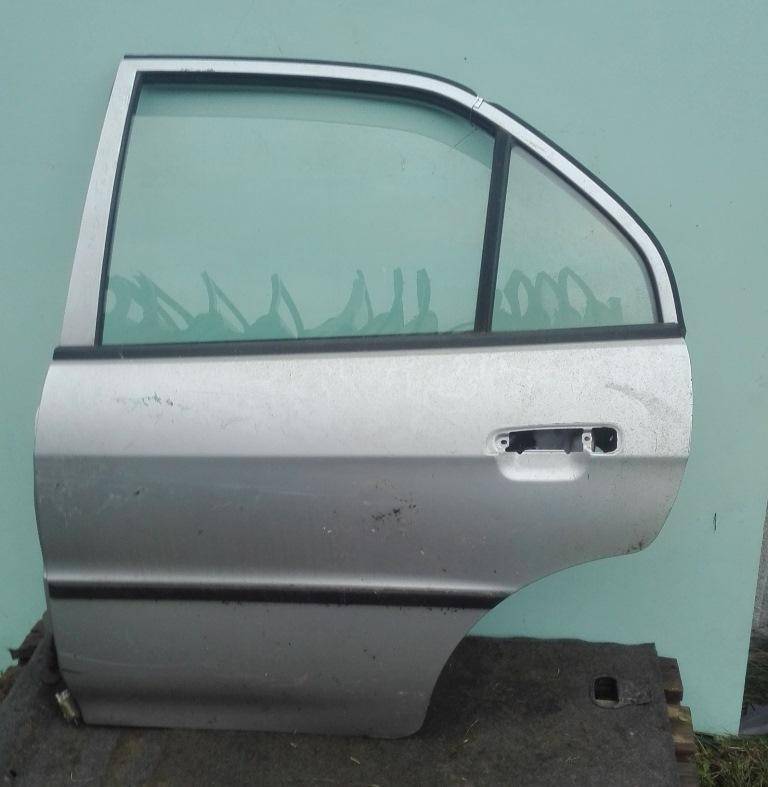 Стекло двери задней левой Mitsubishi Lancer 6 купить в Беларуси