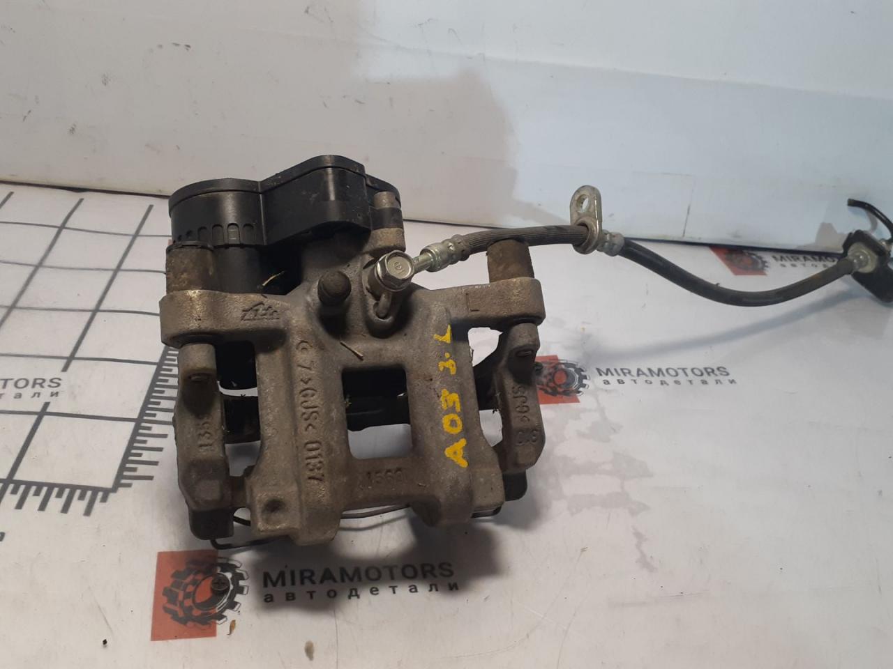 суппорт задний левый Acura TLX 3-е поколение 2022, 2.0 л., бензин, АКПП, белый, седан, 43230-TJB-A030-M1 - фото №1