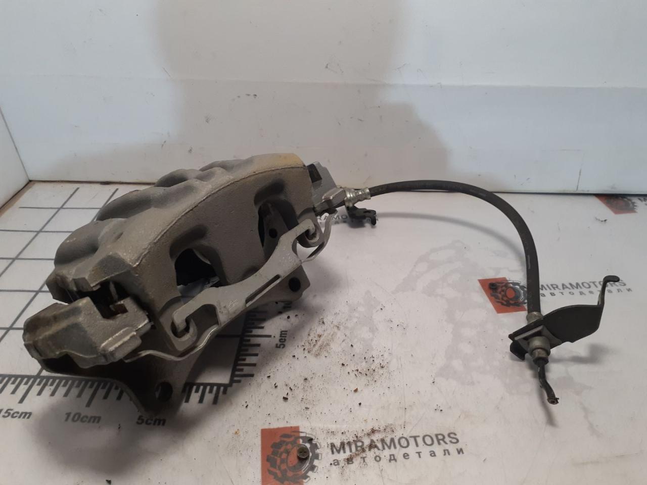 суппорт передний левый Acura MDX 4 поколение 2022, 3.5 л., бензин, АКПП, серый, внедорожник 5 дв. - фото №1