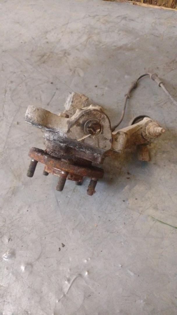 кулак поворотный правый Dodge Caravan 4 поколение (2000 - 2007), 04694948AA - фото №1