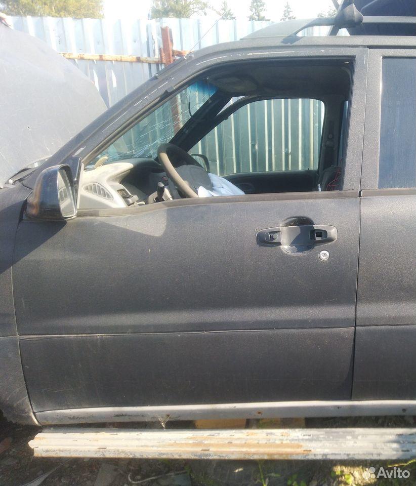 дверь передняя левая Chevrolet Tracker 2 поколение (1998 - 2004), 2.5 л., бензин, АКПП, полный привод - фото №1