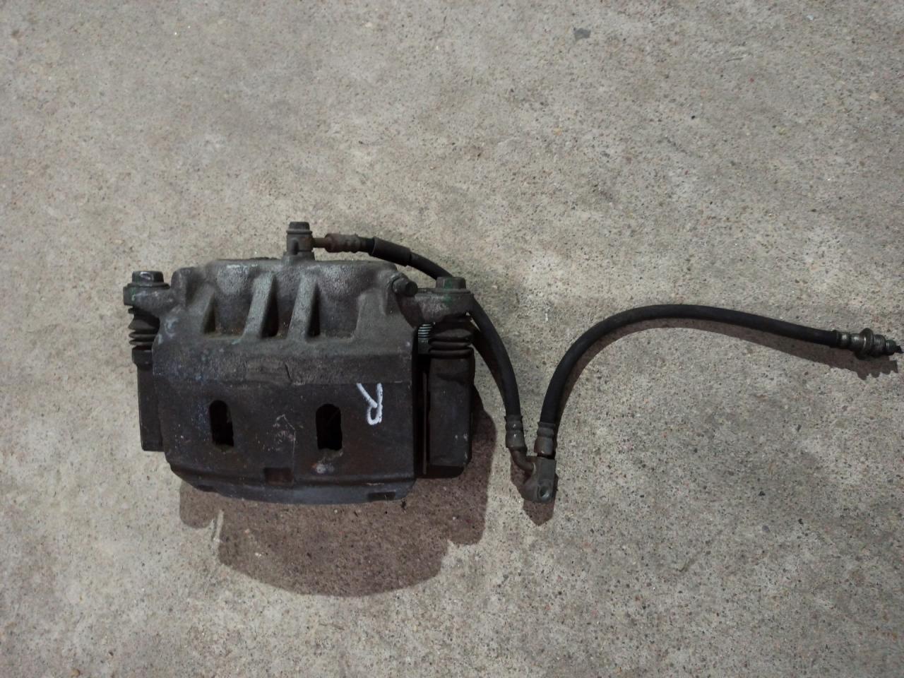 суппорт передний правый Infiniti QX80 1 поколение Z62 2014, 5.6 л., VK56DE, бензин, АКПП, белый, внедорожник 5 дв., задний привод - фото №1