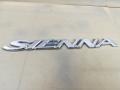 эмблема Toyota Sienna 2 поколение [рестайлинг] 2009, 3.5 л., 2GR-FE, бензин, АКПП, красный, минивэн, передний привод - фото №2