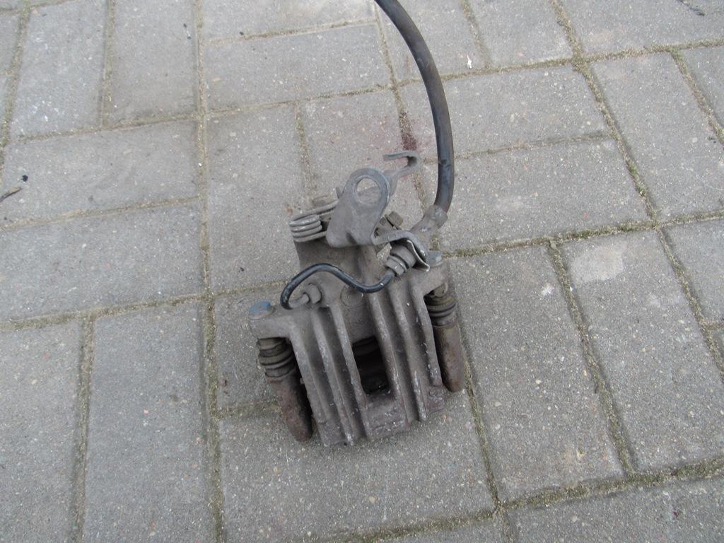 суппорт задний левый Volkswagen Golf 5 поколение 2008 - фото №1