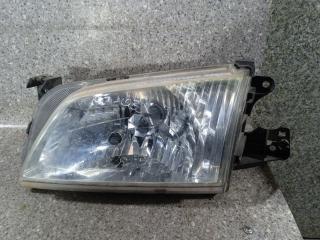 фара левая Mazda Demio DW [рестайлинг] (1999 - 2007)