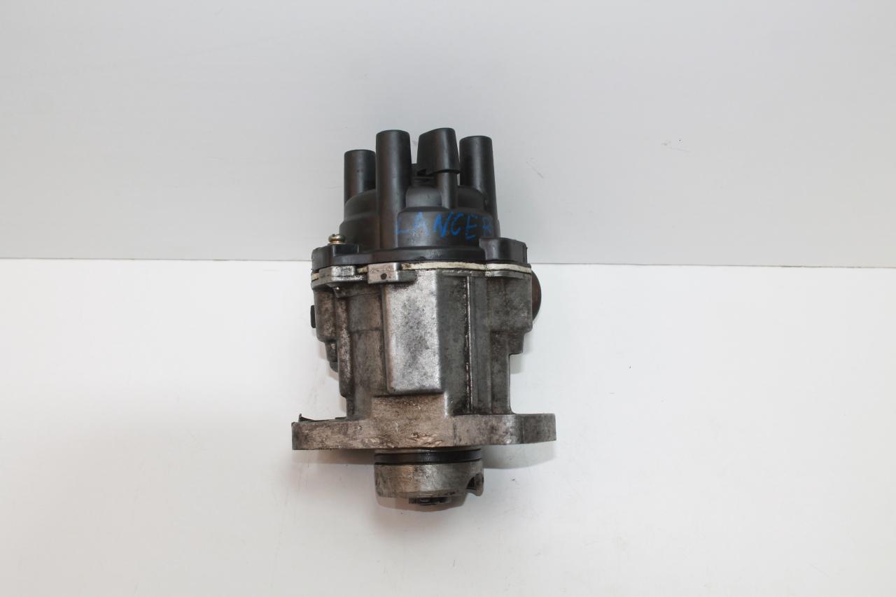 распределитель зажигания (трамблёр) Mitsubishi Lancer 8 поколение A140 1997, 1.5 л., бензин, АКПП, темно-зеленый, седан, передний привод - фото №1