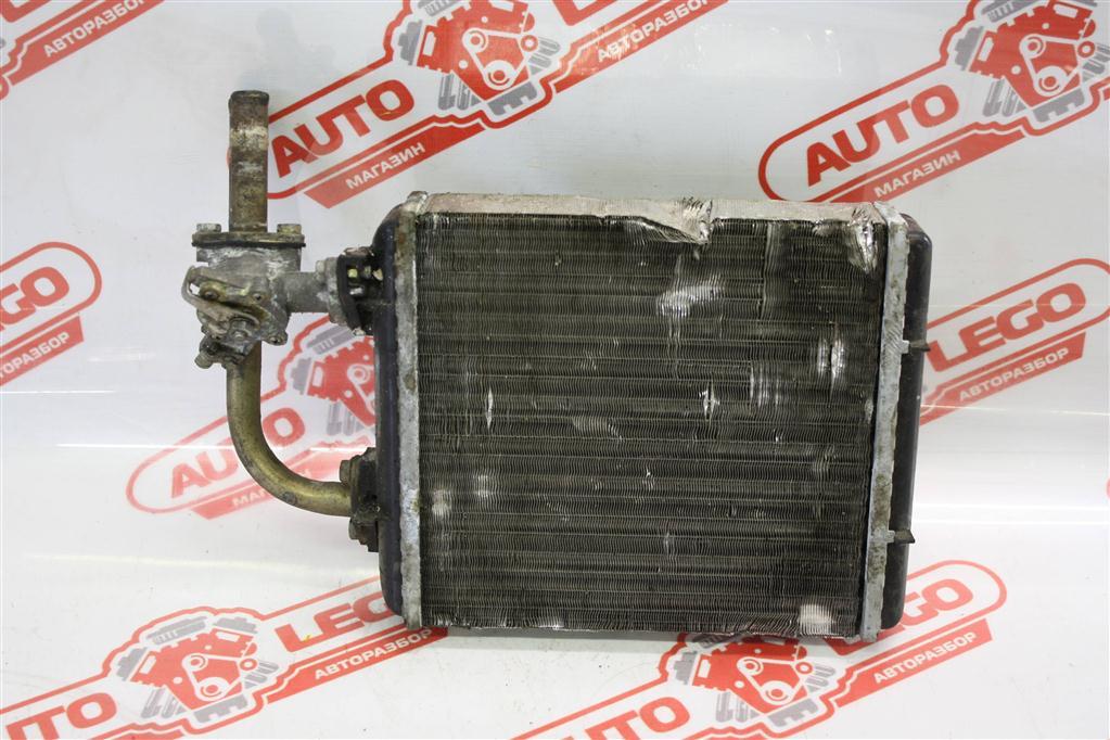 радиатор отопителя (печки) Lada 2107 1 поколение 1990, 2103, бензин, МКПП, красный, седан, задний привод - фото №1