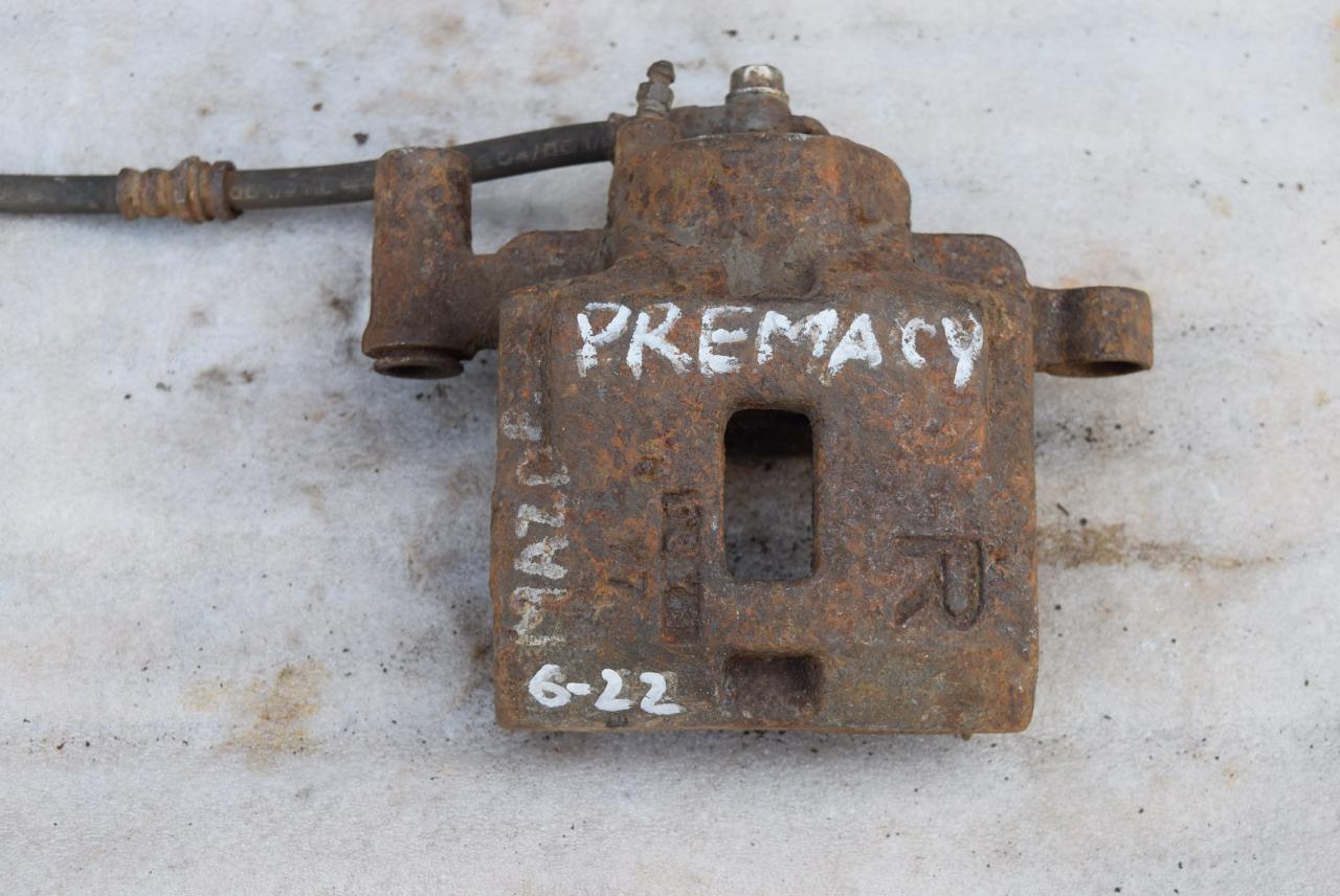 суппорт передний правый Mazda Premacy 1 поколение 2000, 2.0 л., дизель - фото №1