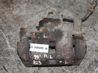 суппорт передний левый Mazda 323 6 поколение (1998 - 2001)