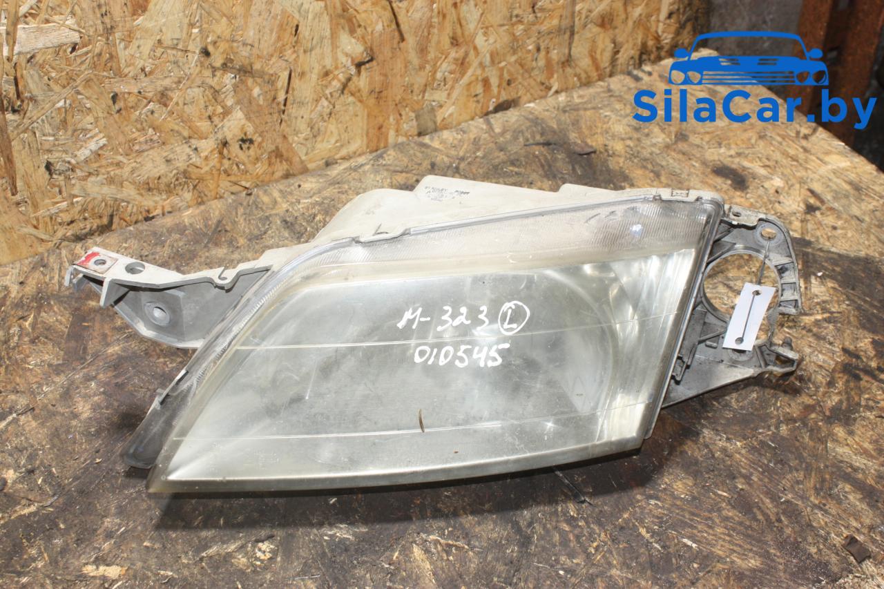 фара левая Mazda 323 6 поколение (1998 - 2001) - фото №1