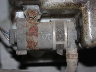 насос (моторчик) омывателя фар Mitsubishi Outlander 1 поколение 2004, 2.0 л., бензин