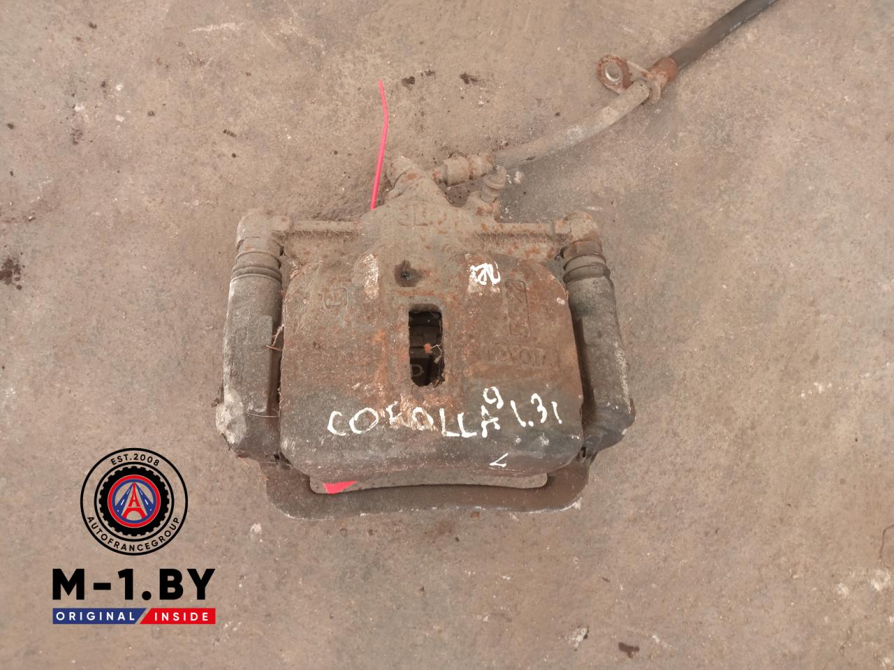 суппорт передний левый Toyota Corolla 9 поколение (E120/E130) (2000 - 2004), 1.3 л., бензин - фото №1