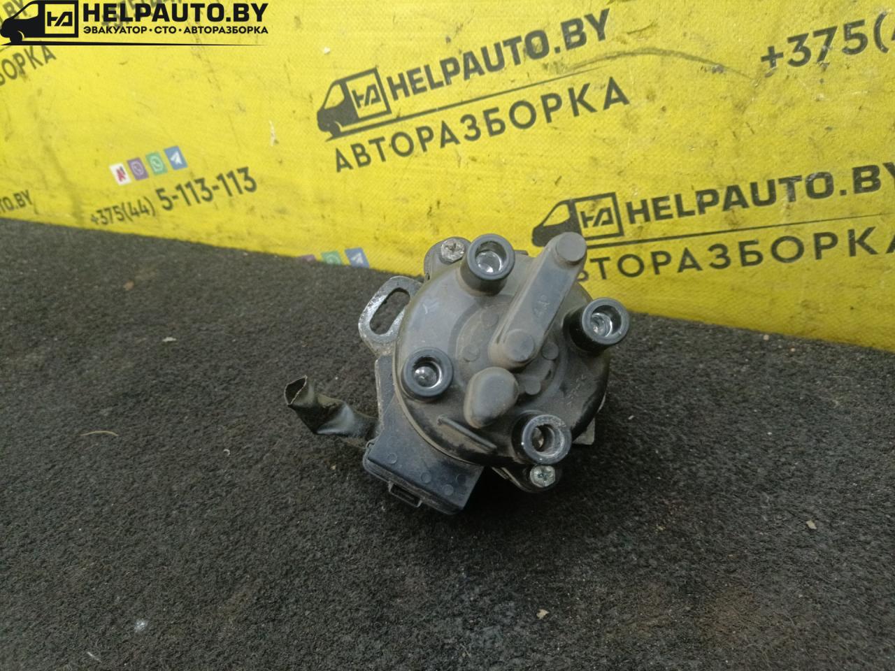 распределитель зажигания (трамблёр) Mazda 323 5 поколение 1997, 1.5 л., бензин, МКПП, зелый, хетчбэк 5 дв., передний привод - фото №1