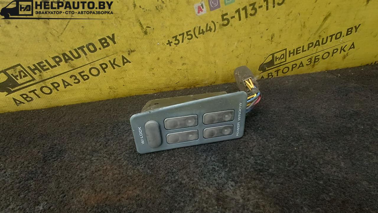 блок управления стеклоподъемниками Kia Sephia 1 поколение 1993, 1.5 л., бензин, МКПП, белый, седан - фото №1