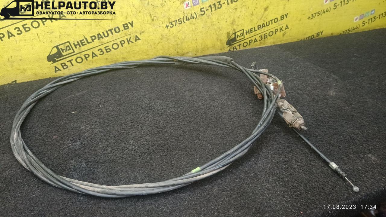 трос открывания лючка топливного бака Mazda MX-3 1 поколение 1995, 1.6 л., бензин, МКПП, красный, хетчбэк 3 дв. - фото №1