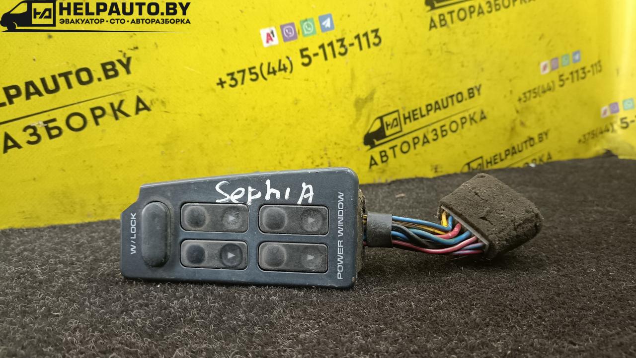 блок управления стеклоподъемниками Kia Sephia 1 поколение 1993, 1.5 л., бензин, МКПП, белый, седан - фото №1