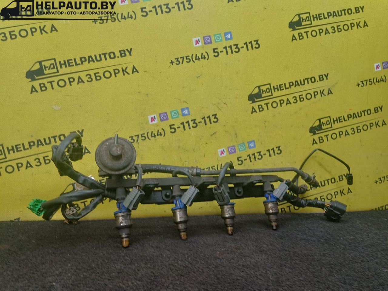 топливная рампа Mazda MX-3 1 поколение 1995, 1.6 л., бензин, МКПП, красный, хетчбэк 3 дв. - фото №1
