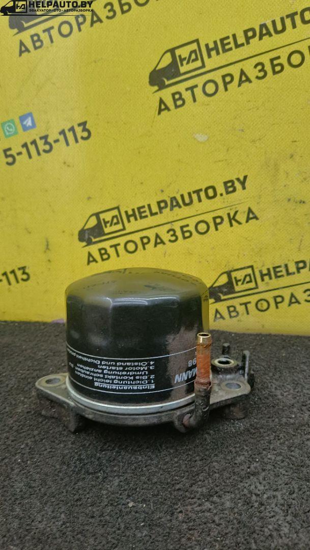 корпус масляного фильтра Mazda 323 6 поколение 1998, 2.0 л., дизель, МКПП, синий, хетчбэк 3 дв. - фото №1