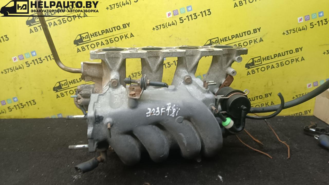 коллектор впускной Mazda 323 5 поколение 1994, 1.8 л., BP (DOHC), бензин, МКПП, красный, хетчбэк 5 дв., передний привод - фото №1