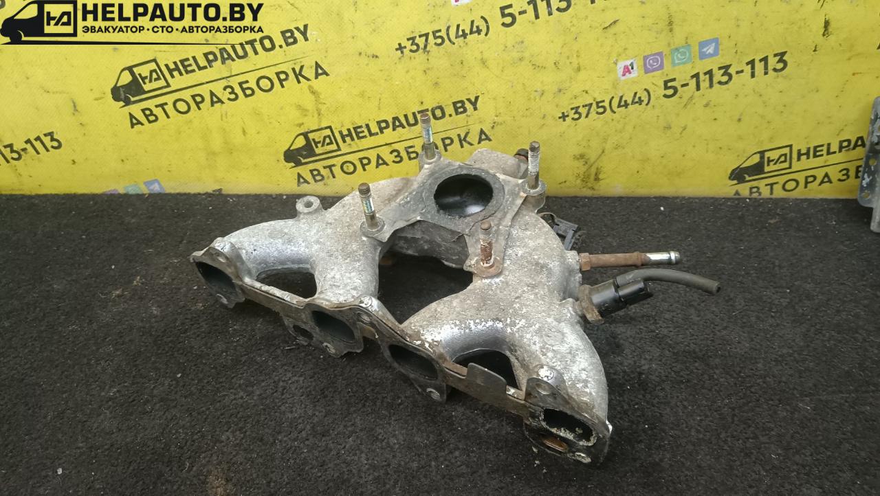 коллектор впускной Toyota Corolla 5 поколение (E80) 1984, 1.3 л., бензин, МКПП, красный, хетчбэк 5 дв., передний привод - фото №1